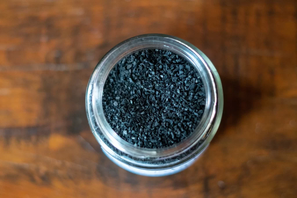 help a dog vomit with activated charcoal.